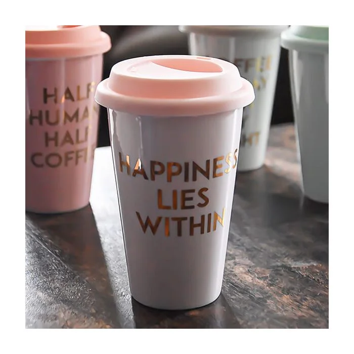 Baby Pink Travel Mug with the Slogan "Happiness Lies Within"