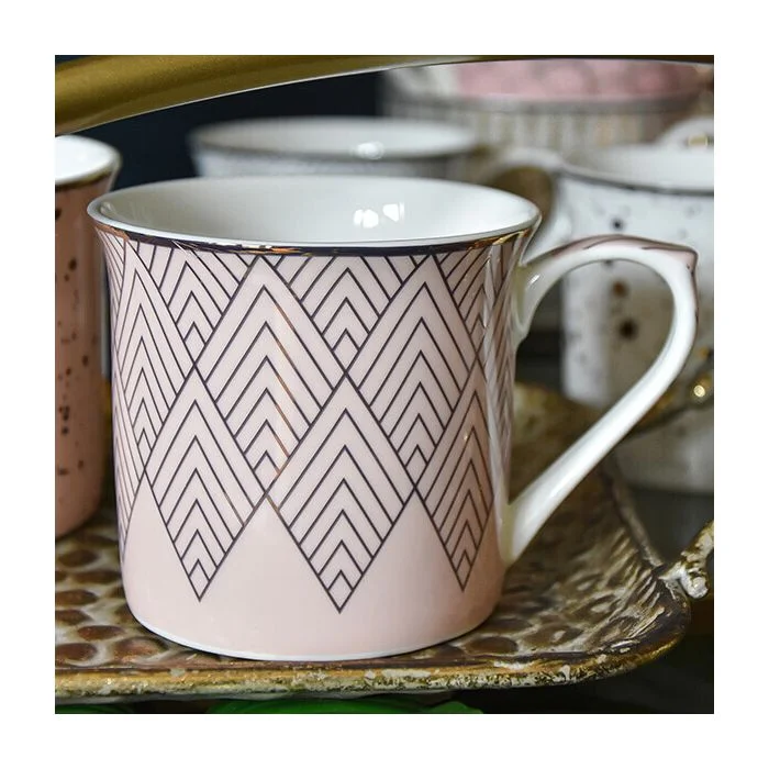 Pink and Gold Mug with a White Handle and Geometric Design